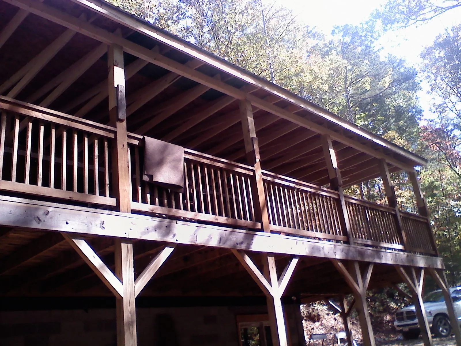 Timber framing under a new elevated porch and deck — Roof Leak Repair in Water View by Roofing Brothers
